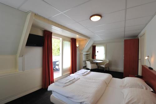 En eller flere senger på et rom på 't Streefkerkse Huis