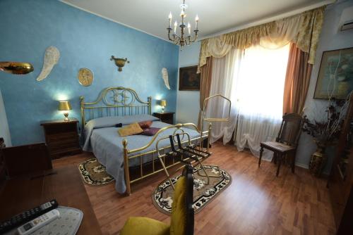 A bed or beds in a room at B&B Oasi Degli Angeli