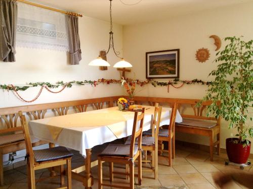 a dining room with a table and chairs at Haus Margit in Schlierbach