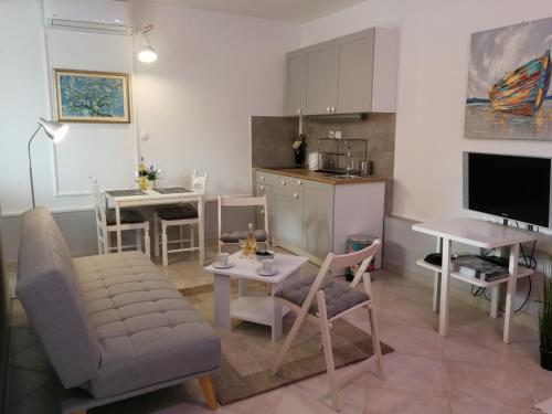Kuchyň nebo kuchyňský kout v ubytování Apartman Unka