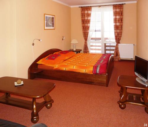מיטה או מיטות בחדר ב-Resort Maják