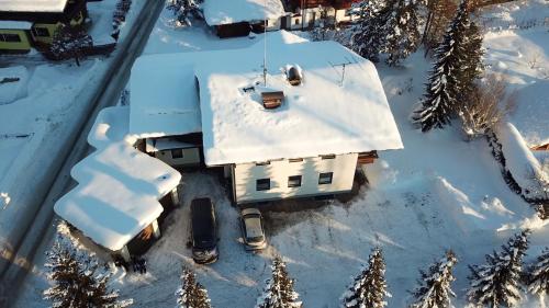 an aerial view of a house covered in snow at Appartements Winter Anita in Flachau