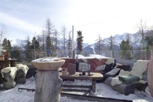 a living room with a couch and a sink at Chalet Bergmann in Bürchen