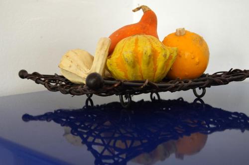 a basket of vegetables on top of a table at APARTMÁN V ZAHRADĚ PRAHA TROJA - APARTMENT IN THE GARDEN PRAGUE Troja in Prague