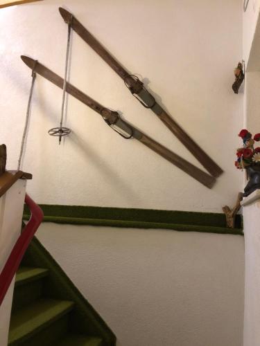 a group of objects on a wall next to a staircase at Haus Helli in Berwang