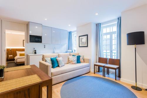 a living room with a couch and a table at Augusta Residence Apartments in Lisbon
