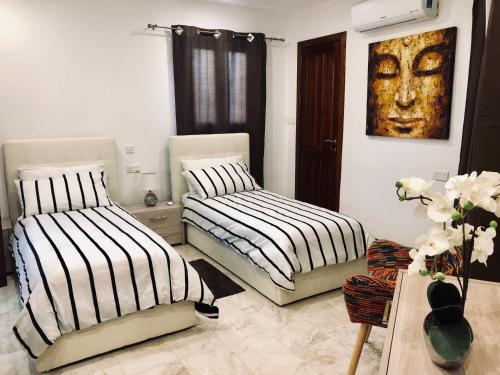 Modern Maltese House tesisinde bir odada yatak veya yataklar