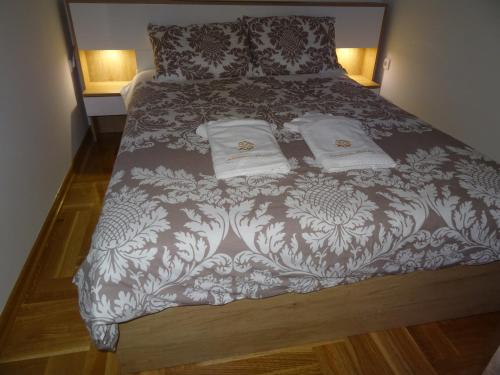 Postel nebo postele na pokoji v ubytování Apartman Dmitrov