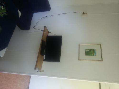 Televisyen dan/atau pusat hiburan di Åros Feriesenter
