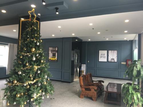a christmas tree in the middle of a room at Phuong Thuy Hotel Thu Duc near QL13 in Ho Chi Minh City