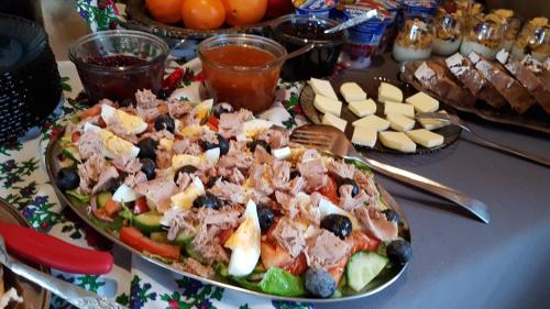 a table with a plate of food on a table at Antonówka in Trybsz