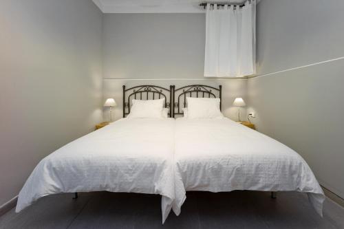 Ліжко або ліжка в номері Amplio apartamento con terraza en zona muy tranquila
