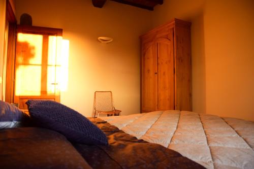 Кровать или кровати в номере Mugello Tuscany Bosso di Sopra