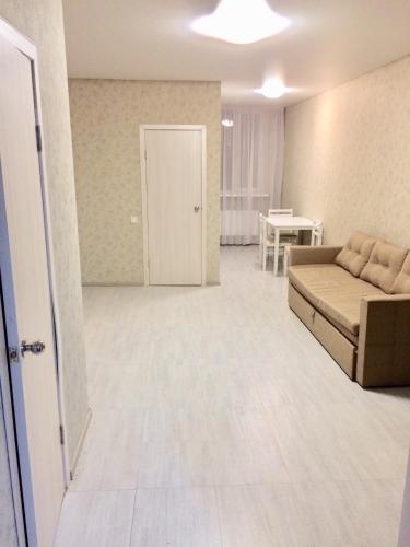 a living room with a couch and a table at Mega city in Kyiv
