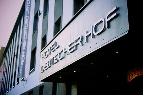 a sign on the side of a building at Hotel Deutscher Hof in Kassel