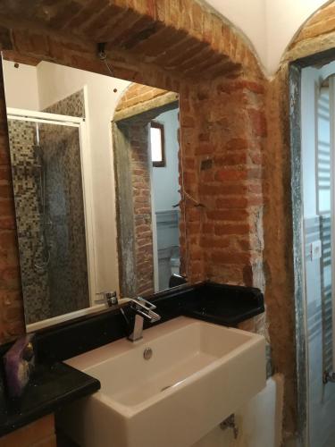 a bathroom with a sink and a mirror at B&B A Casa Mia in Pisa
