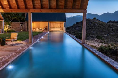 a swimming pool in the backyard of a house at 7 Koppies in Franschhoek