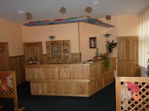 a large room with a large island in a building at Hotel & Restaurant Na Fryštátské in Karviná
