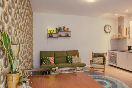 a living room with a couch and a table at SOEPP hotel & restaurant in Alkmaar