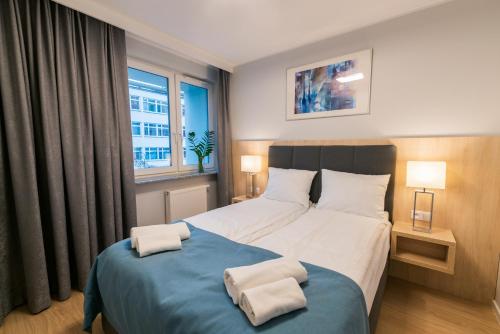 Ένα ή περισσότερα κρεβάτια σε δωμάτιο στο Q17 Apartments Rynek
