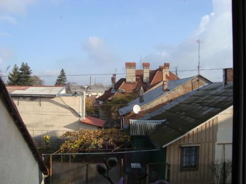 a view of a group of buildings with roofs at Apartment in the historical city center in Chernivtsi