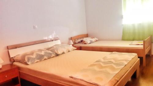 Postel nebo postele na pokoji v ubytování Apartman Kolan