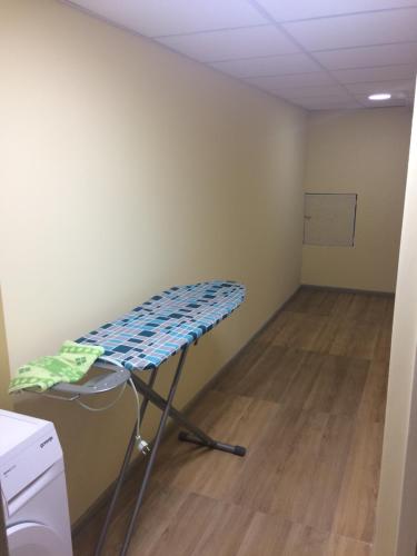 a room with a table and a chair in it at Mega city in Kyiv