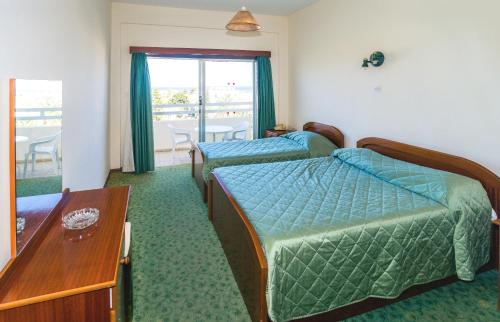 Postel nebo postele na pokoji v ubytování Marion Hotel