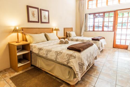 Katil atau katil-katil dalam bilik di Treetops Guesthouse
