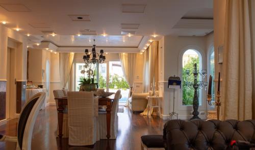 a living room with a couch and a table at White House Luxury Hospitality in Olbia