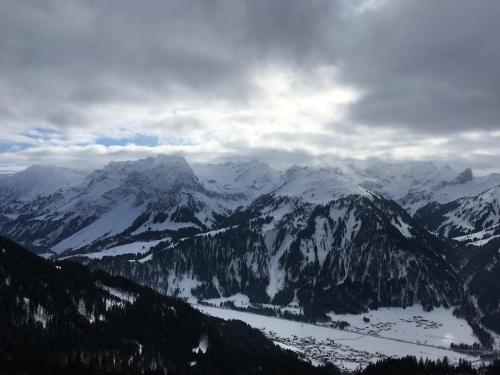 a view of a mountain range with snow covered mountains at Appartement Bettina in Schoppernau