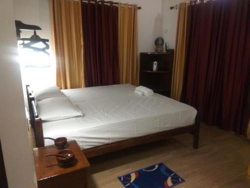 Katil atau katil-katil dalam bilik di SAGAR BEACH VILLAS Home stay