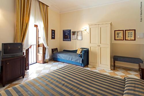 A bed or beds in a room at terrazze di montelusa