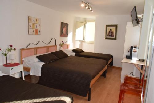 Un pat sau paturi într-o cameră la Il Trespolo Degli Angeli