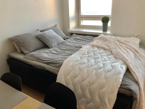 Un ou plusieurs lits dans un hébergement de l'établissement Scandinavian Sweet home 18 Heart of City