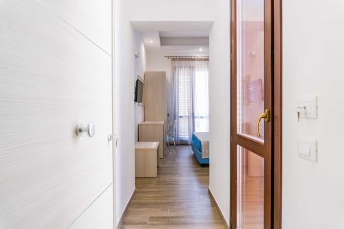an open door to a room with a hallway at B&B Le Tartarughe in San Vito lo Capo