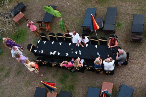 a group of people sitting around a table at Sath Villa Naadi Ayurveda Resort in Moragalla