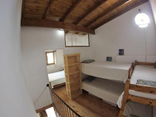 Ένα ή περισσότερα κρεβάτια σε δωμάτιο στο Casitas Sancle