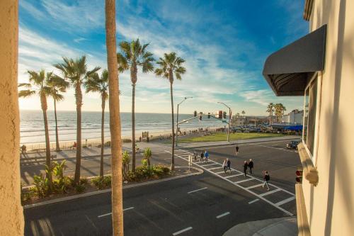 a view of a street with palm trees and the ocean at Tamarack Beach Hotel in Carlsbad