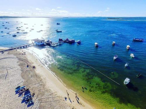 an aerial view of a beach with boats in the water at Propriedade Silva in Gamboa