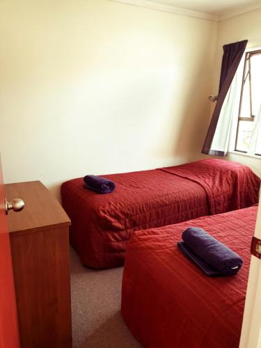 Un ou plusieurs lits dans un hébergement de l'établissement Oxford Court Motel