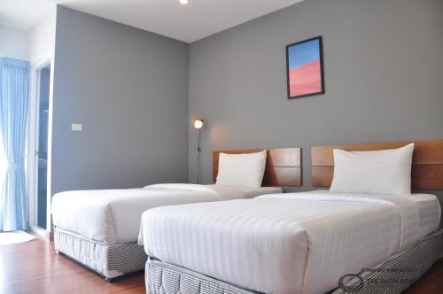 Postel nebo postele na pokoji v ubytování The iKon Apartment