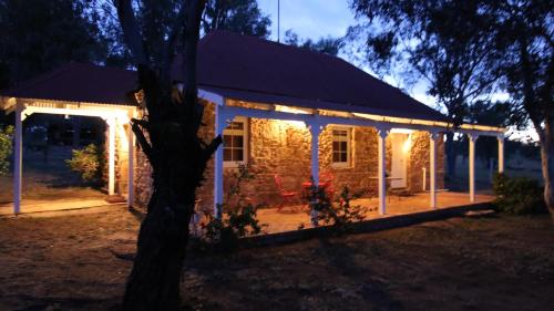 a house lit up at night with lights at Dempster Cottage in Irishtown