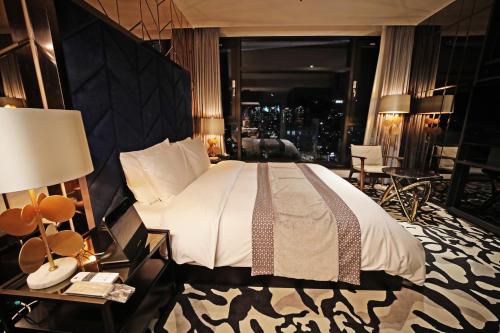 Кровать или кровати в номере Best Louis Hamilton Hotel Gwangan