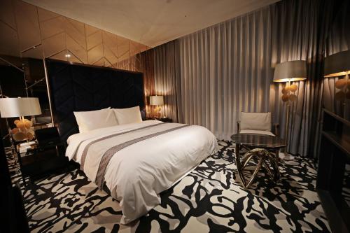 Кровать или кровати в номере Best Louis Hamilton Hotel Gwangan