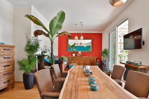 a dining room with a wooden table and chairs at Landvilla Pia in Attendorf