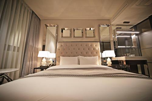 Кровать или кровати в номере Best Louis Hamilton Hotel Gwangan