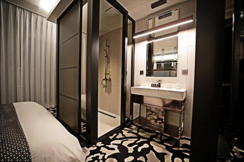 Кровать или кровати в номере Best Louis Hamilton Hotel Gwangan