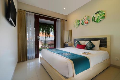 Un pat sau paturi într-o cameră la Vansari Hotel
