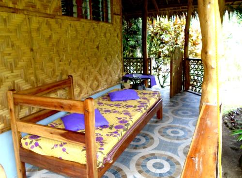 Un ou plusieurs lits dans un hébergement de l'établissement Nypa Style Resort Camiguin